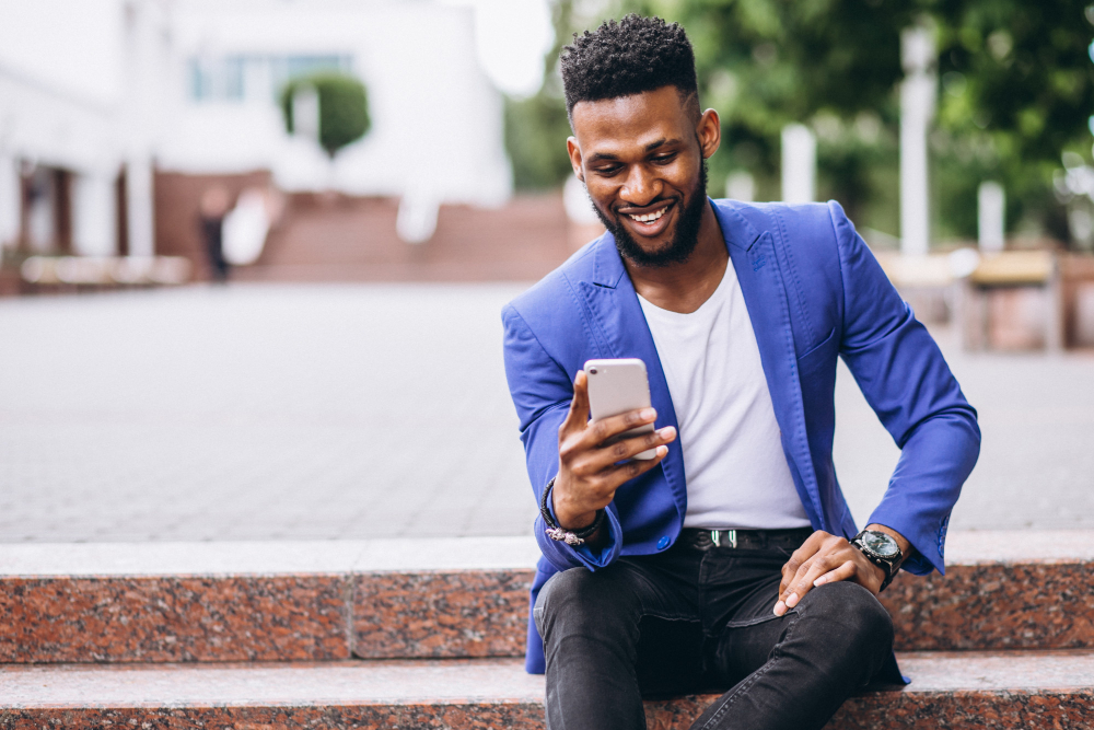 Happy user paying bills on phone